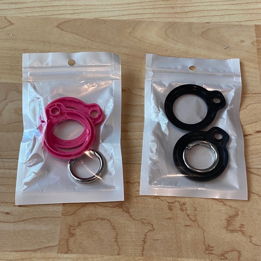 Bundle of 2 Pink and Black Silicone Air tag holder Rings - never used